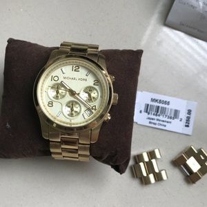 Michael Kors gold watch.